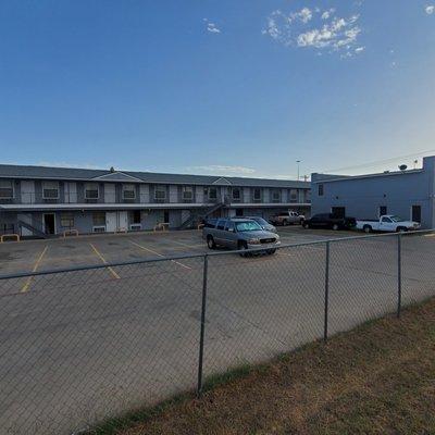 View of hotel and parking lot.