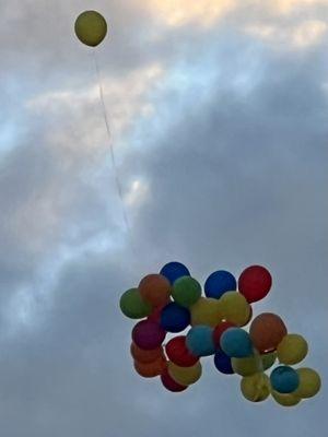 Balloon Release. People all dressed up for The Parking Lot Party The Parrot Heads before The Jimmy Buffett  Concert XFinity Center Aug 2022