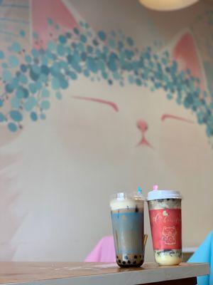 Brown Sugar milk tea with cheese cap and boba on the left. Creamy cake milk tea with cheese cap, Oreo, and boba on the right.