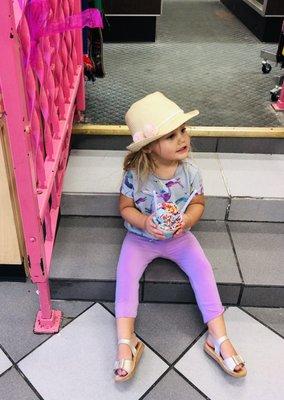 My daughter enjoying our yummy Cotton Candy Ice Cream next to this adorable pink gate/stair-rail