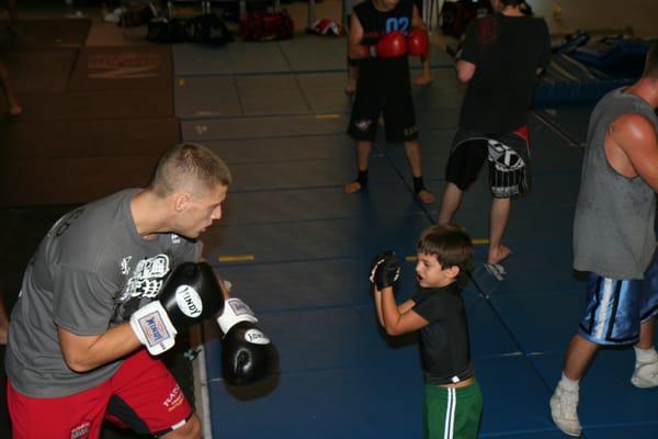 Strikeforce, Bellator and KOTC Vet and FC Coach Bad News Ben Lagmen Giving Dominic (5) some Good Work!!