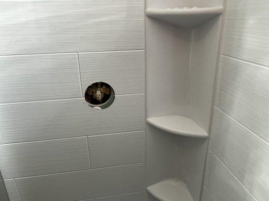 Missing faucet handle and cover plate.