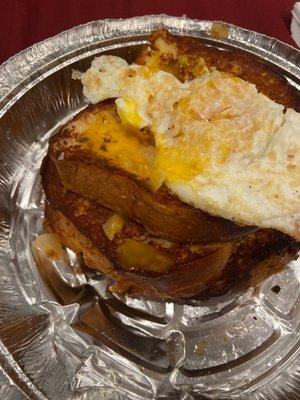 French toast with egg yolk bursted on to it