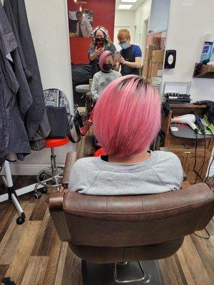 My teenager rocking her hot pink hair color, and super cool side shave haircut done by our favorite stylist Danny.