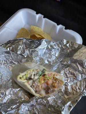 Steak burrito, queso,rice, refried beans, pico, hot salsa, cilantro and guac.