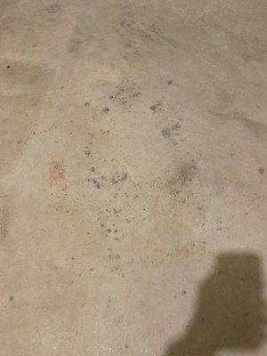 Chunks of cement left all over floor