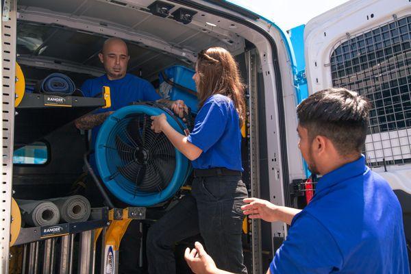 Critical Control team pulling out drying equipment for a water damage loss that happened nearby.