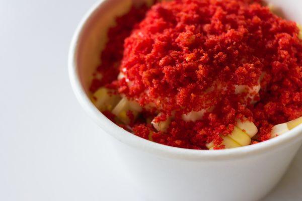 Hot Cheeto Elote served in a cup