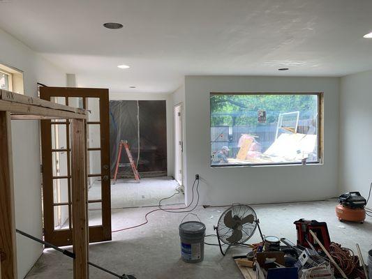 remodeling garage in live room.  New floor, walls, windows, fireplace, ceiling, lights and more.