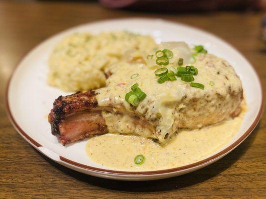 Pork Chop & Gouda grits topped with their "Lafitte sauce"  AKA crawfish cream sauce. Amazeballs :)...