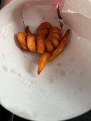 Curly fries taste like old chicken grease from two days ago