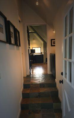 Danville - Painted hallway with stairs. Slanted ceiling.