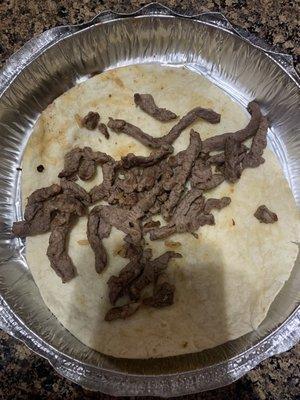 The inside of what should be a carne Asada burrito.