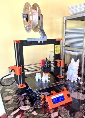 3D printer busy printing more french bull dog motifs.