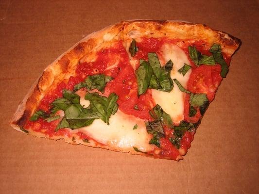 Pizza Margherita: Red sauce, fresh mozzarella, tomatoes, fresh basil