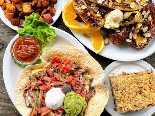 Breakfast spread of Tostada, Famous Banana French Toast, blueberry coffee cake, grilled homestyle potatoes.