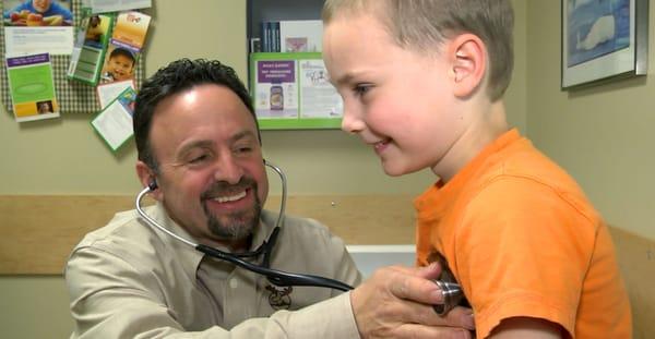 Dr. John checks the heartbeat of one of our little patients.