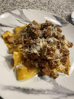 Proper sausage's signature bolognese with egg pappardele topped with shaved Parmesan. All 3 ingredients from their market/cold section.