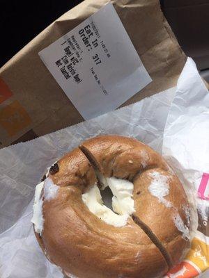 Cream cheese everywhere. All over wrapper, all over bag, smeared all over outside of bagel.