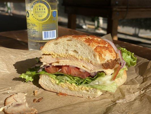 Half of a whole Cajun turkey sandwich with Dutch crunch bread, with lettuce, Dijon mustard, onions and smoked Gouda. Yummm.