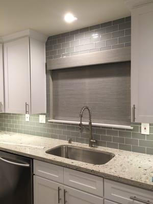 Backsplash added to the ceiling to match existing backsplash