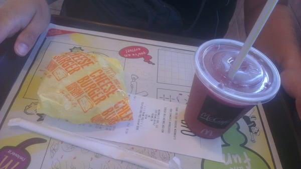 Cheese burger, 0.99$!! S Blue Pom Smoothie, 2.49$.