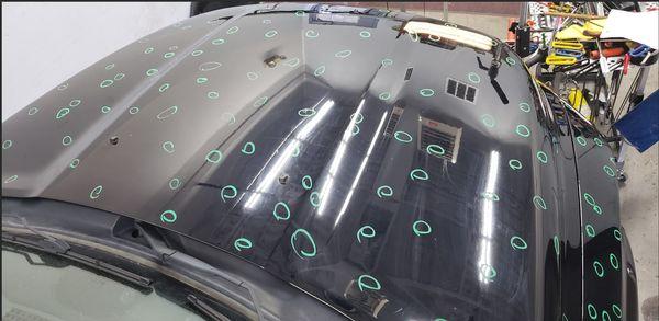 Hail marks on Luxury car being repaired by the Scratch Master