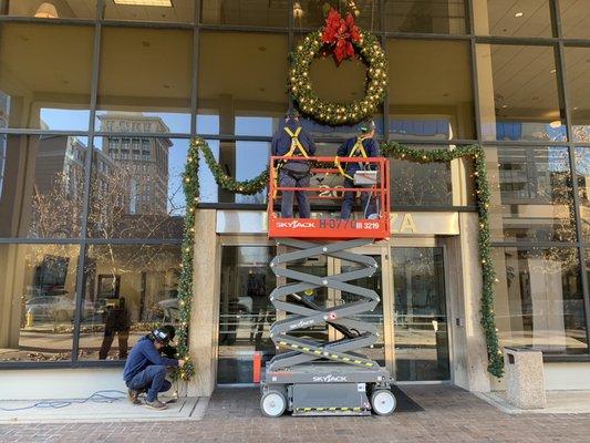 Christmas Time hanging up lights downtown Lexington Ky