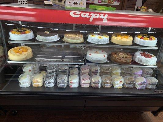 The row of the cake slices on the bottom are all tres leches just different flavors