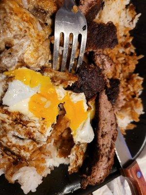 Beef patty from Loco Moco. Couldn't cut through the patty-had to break with my fingers. Wow!