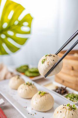 Our Q-Bao are tasty buns filled with moist pork and wrapped with half fluffy, half crispy dough.