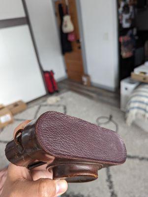 Very different leather color and texture used for the top repair