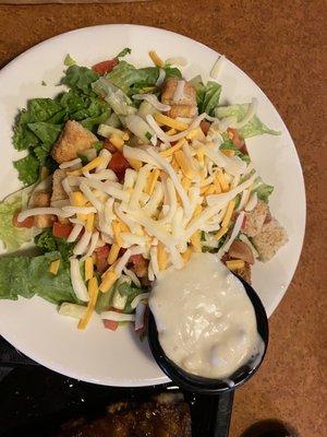 Side House Salad with soggy bread crumbs before they were removed.