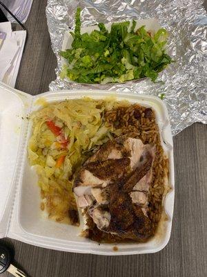 Jerk chicken white lunch combo with red beans and rice cabbage and salad.