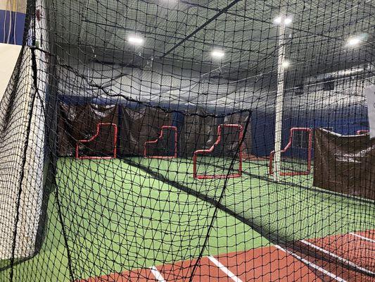 Baseball and Softball batting cages with protective L-Screens and Floor Hitting Mats.