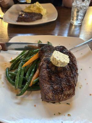 Ribeye steak and seasonal vegetables