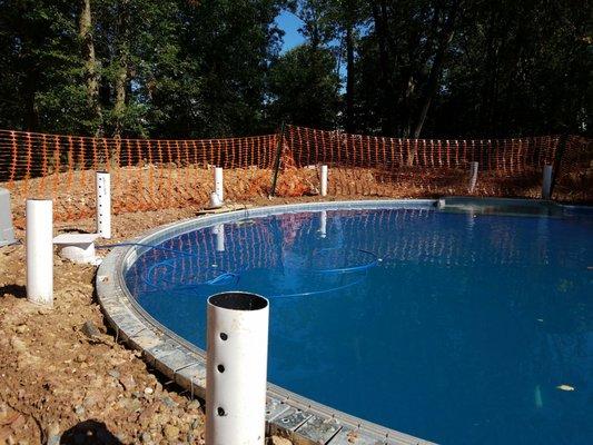 They left huge mounds of dirt very close to the pool the same dirt washed into the pool when it rained