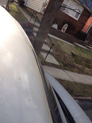 Roof of van. middle top of windshield.