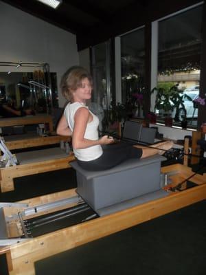 Rowing Forward on the box on the Reformer