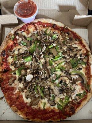 This is a medium green pepper, double mushroom pizza