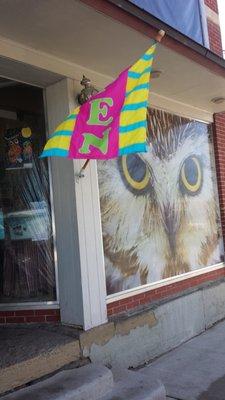 This pretty owl is looking right at me, at the entry of the International Owl Center.