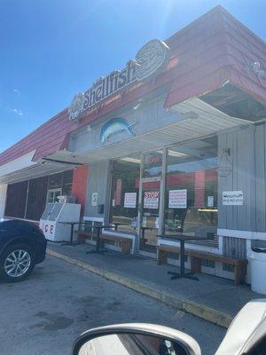 Storefront with COVID signs for safety