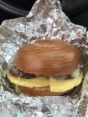 Plain bagel, egg, sausage, and pepper jack cheese.