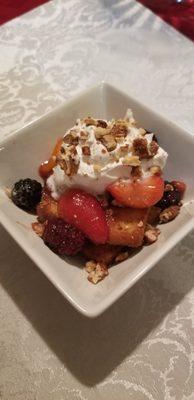 Fresh berry compote over grilled pound cake and homemade whipped cream and toffee crumble.