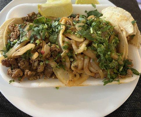 Asada tacos w/ cilantro and onions. Yummy