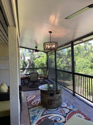 2 fans and a light fixture, wired for and installed on a flat insulated patio roof.