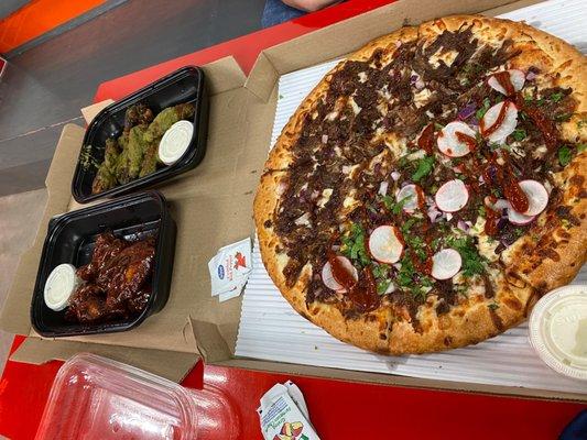 carne asada half pizza, hot bbq and Jamaican jerk wings