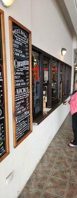 Customers walk up to this window and place their orders. The location is right next to the Ben Franklin store in Pearl City.