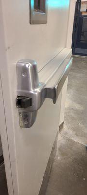 Exit device panic bar crash bar repair at a business. Install new emergency exit bar