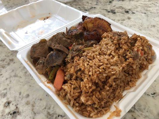 Beef stew, rice with beans, and side of fried plantains.